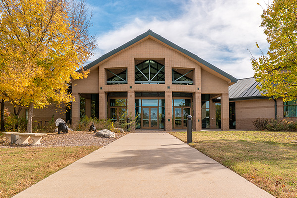 great plains nature center building with a frame roof