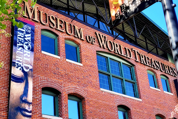 brick walled building letters saying museum of world treasures